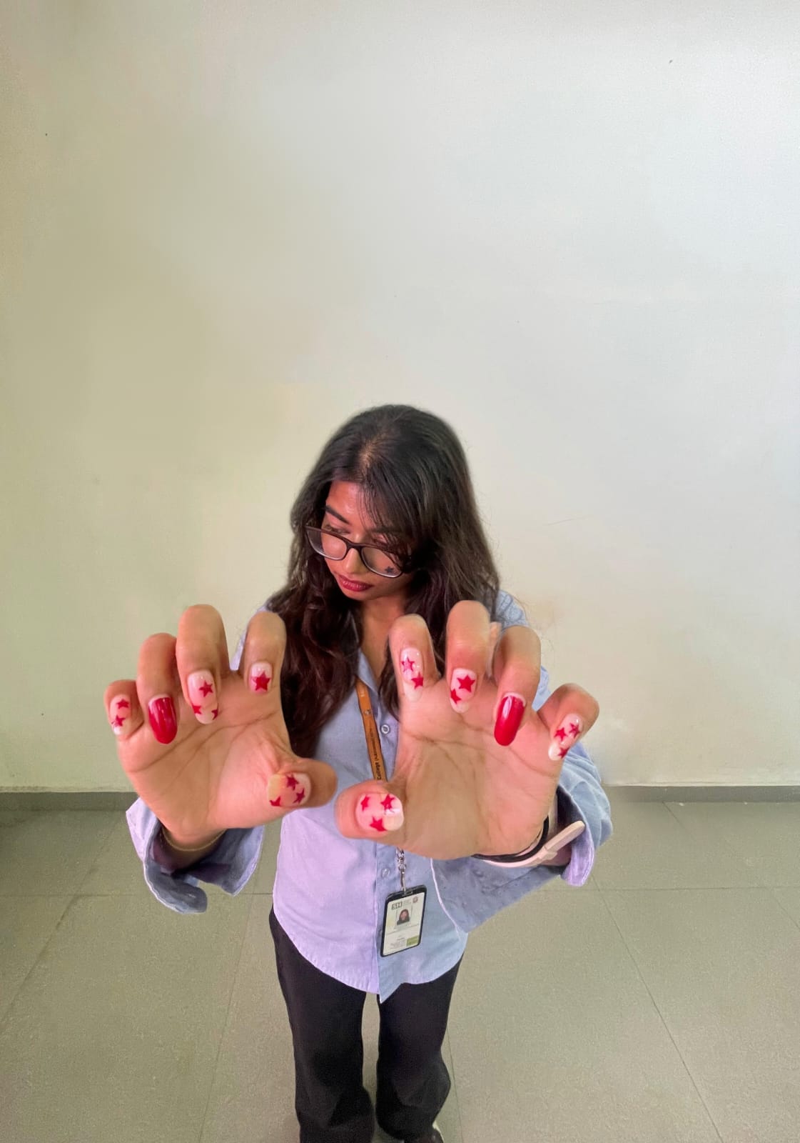 Krystal showing her red star nail art